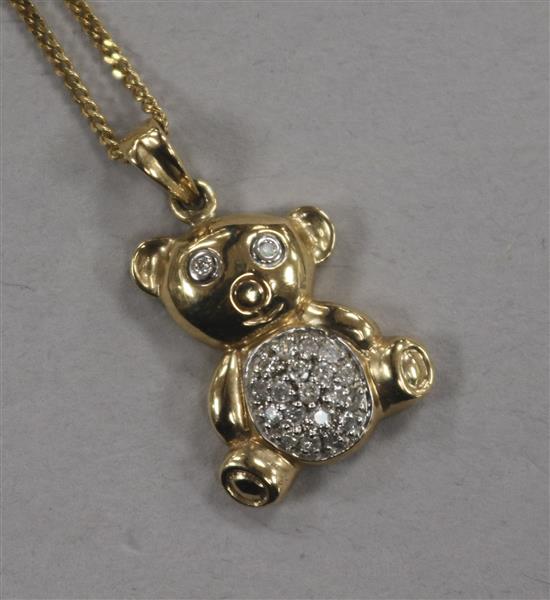 A modern 9ct gold and diamond set teddy bear pendant, on a 9ct gold chain, pendant 18mm.